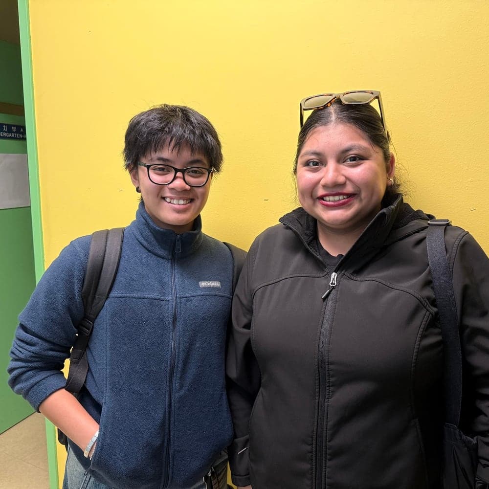 Two Youth Advisory Board members smiling together